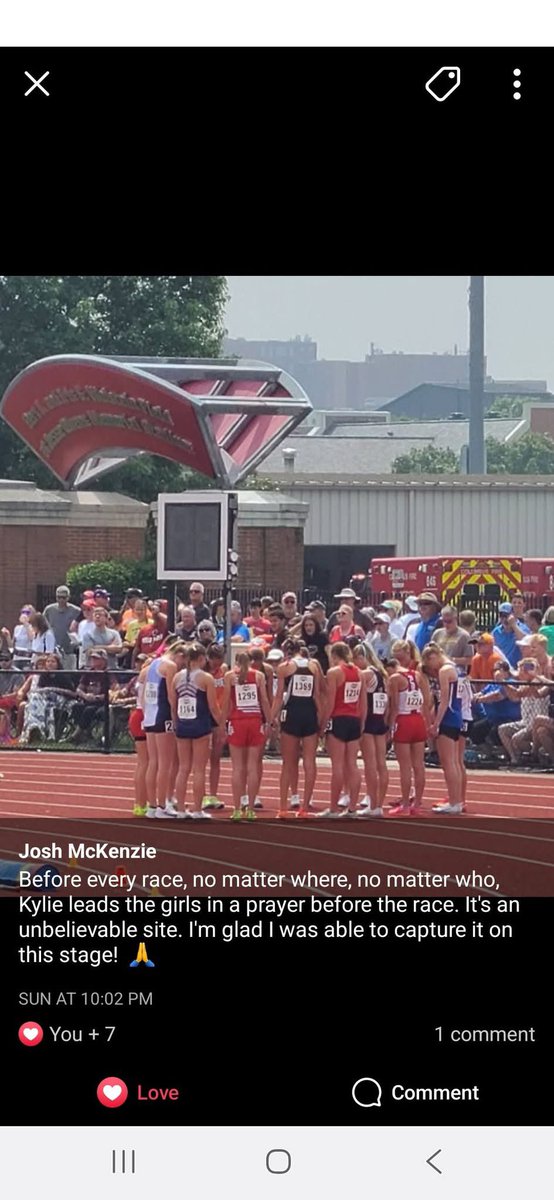 Kylie McKenzie leading runners in prayer before their race at State Track Meet!