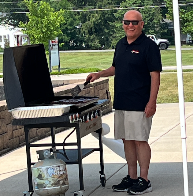 Superintendent Horner is grilling up some burgers and brats for the annual summer staff carry-in. He even brings his own grill! Happy summer!