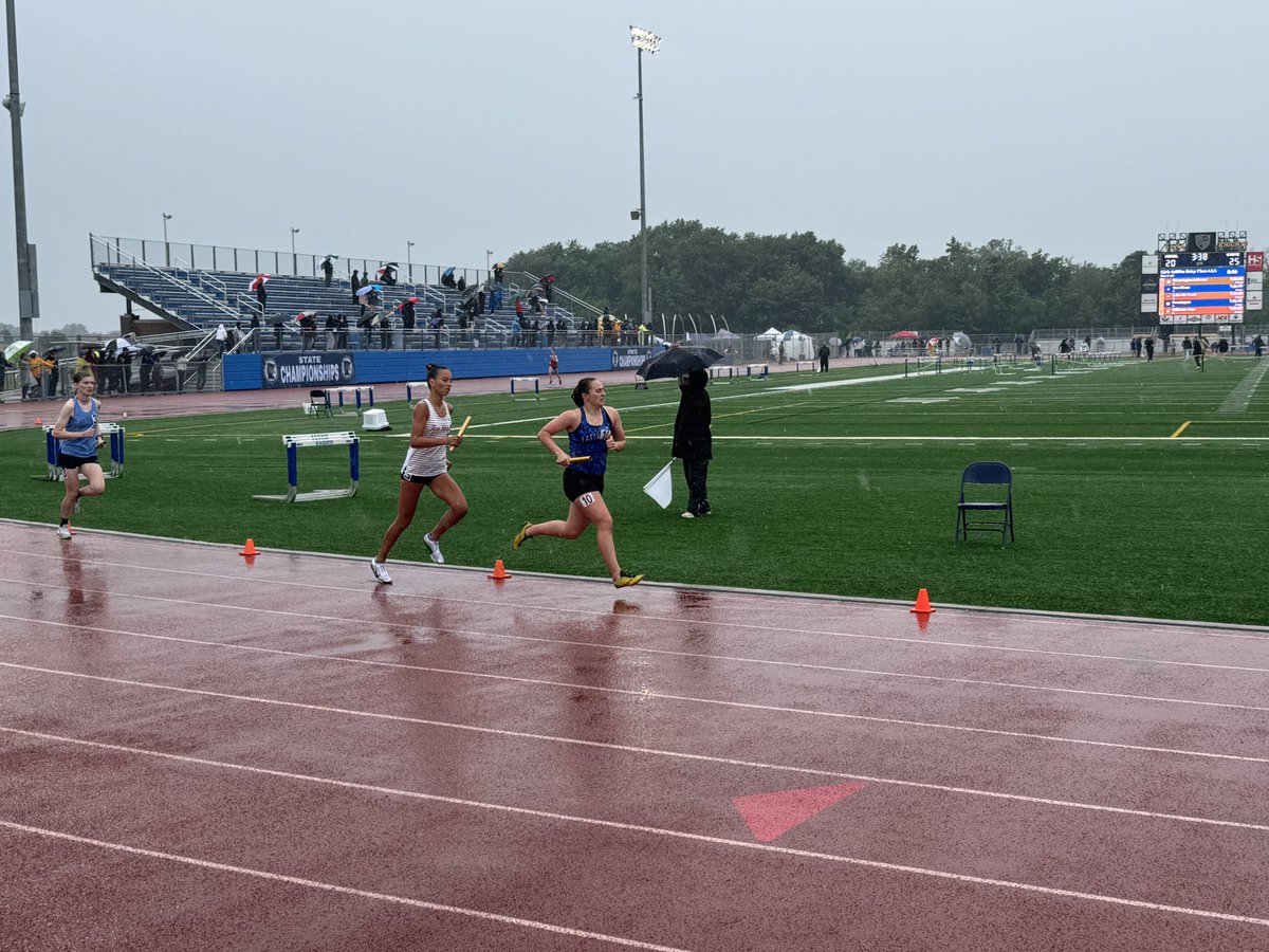 Girls 4 x 800 giving it their all in the pouring rain today at the state meet in Saint Michael!