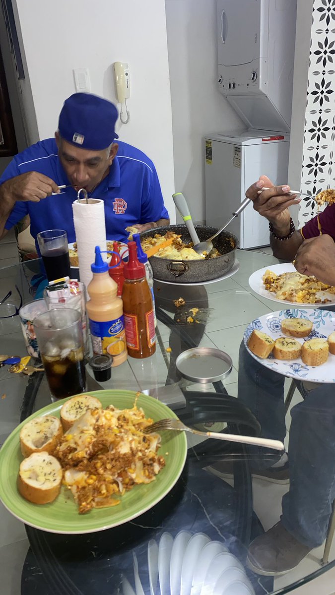 Brother and friend enjoying their home made Lasagna.