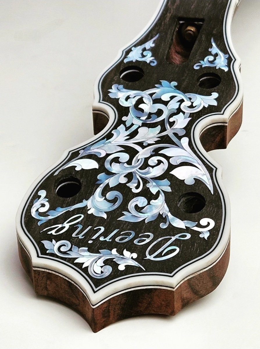 Crafting banjos is a #fineart. Thought you all may enjoy this photo of a recent Clawgrass #banjo just after the inlays work was completed and the neck was ready for its final hand sanding.