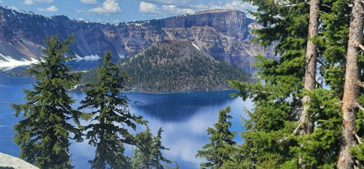 Roscoe, The Bride, and I did Crater Lake National Park today. And yes, the water is BLUE BLUE BLUE. Five trillion gallons of the cleanest water on earth. Almost two thousand feet deep.