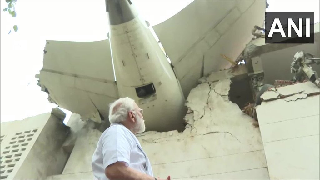 2 things criminally wrong about this picture. 

1. No safety helmet, Prime Minister of the nation is standing directly beneath a #PlaneCrash wreckage with a building that is structurally damaged without any safety gear. 

2. This picture is for PR , a shameless milking of a