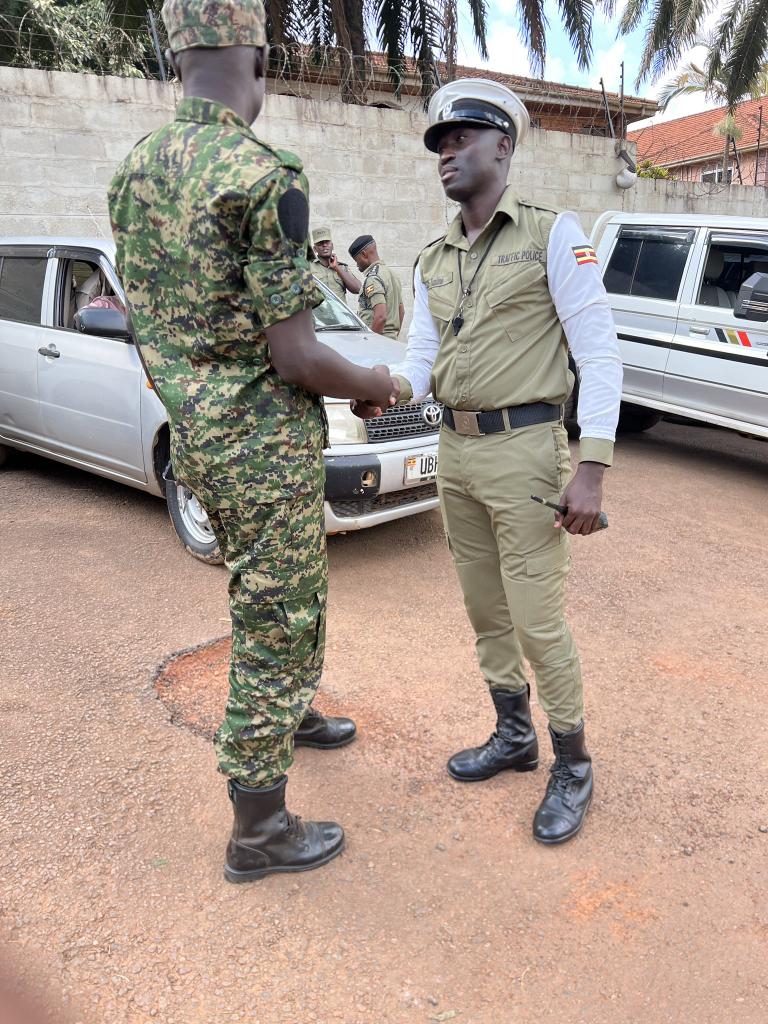 Rwakataka (@rwakatakam) on Twitter photo Traffic commander Afande Tusiime ready to secure <a href="/Plugandaa/">Patriotic League of Uganda</a> members as they match to Germany Embassy Traffic commander Afande Tusiime ready to secure <a href="/Plugandaa/">Patriotic League of Uganda</a> members as they match to Germany Embassy