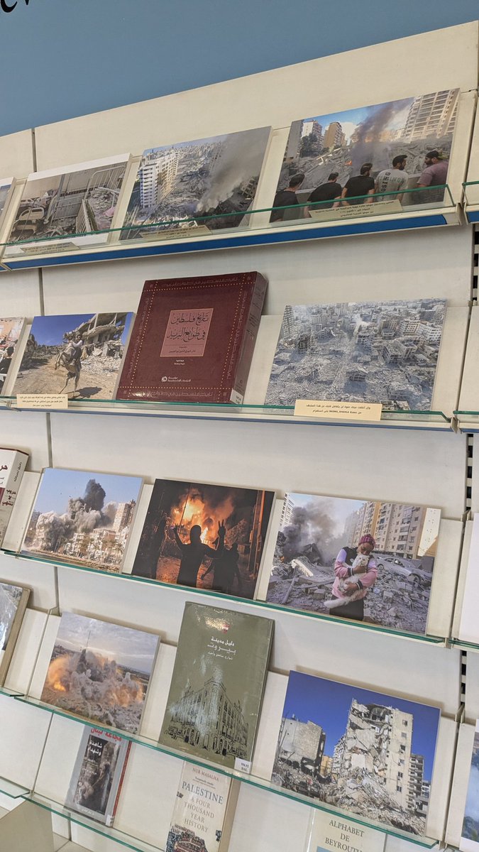 foleywoley's tweet photo. A big thank you to @ghadadimashk for inviting me to see the Fighting Erasure project's photo exhibition From Lebanon to Palestine: Archiving Against War, Erasure and Displacement.

Seeing the photo evidence of the destruction sitting amongst the Assabil Bashoura Library's existing books drove home how important it is we fight to preserve knowledge and histories and the scale of what has been lost.