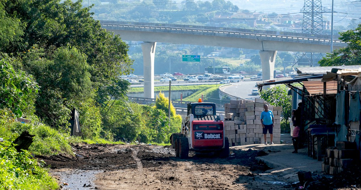TheMercurySA's tweet image. South Africa - Durban - Transport operators frustrated with the poor state of Kennedy Road in Clare Estate hired a grader to fill in potholes and make the road drivable. 
Photographer: Leon Lestrade / Independent Newspapers
#transportoperator #frustration #KennedyRoad #themercury