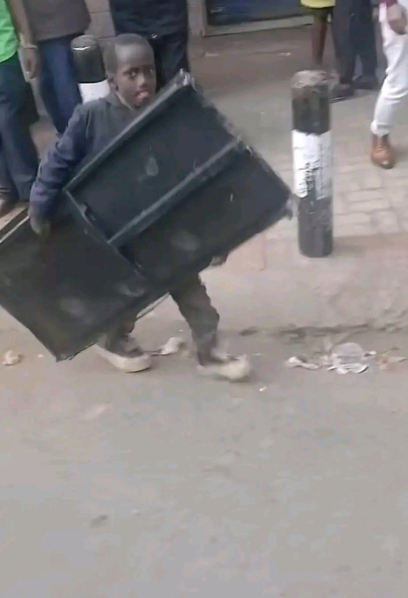 A young boy was spotted in Nairobi CBD running away with the wreckage of vandalized dustbins!
#JusticeForAlbertOjwang