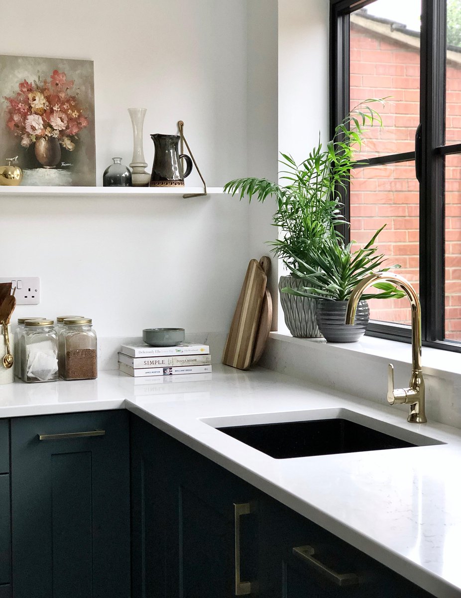 Whether you’re going for an earthy look or something sleek and contemporary, CRL Quartz offers a range of tones to match your shade of green.

Statuario Bianco is a marble-effect quartz that pairs beautifully with earthy green cabinets, creating a harmonious and calming space.