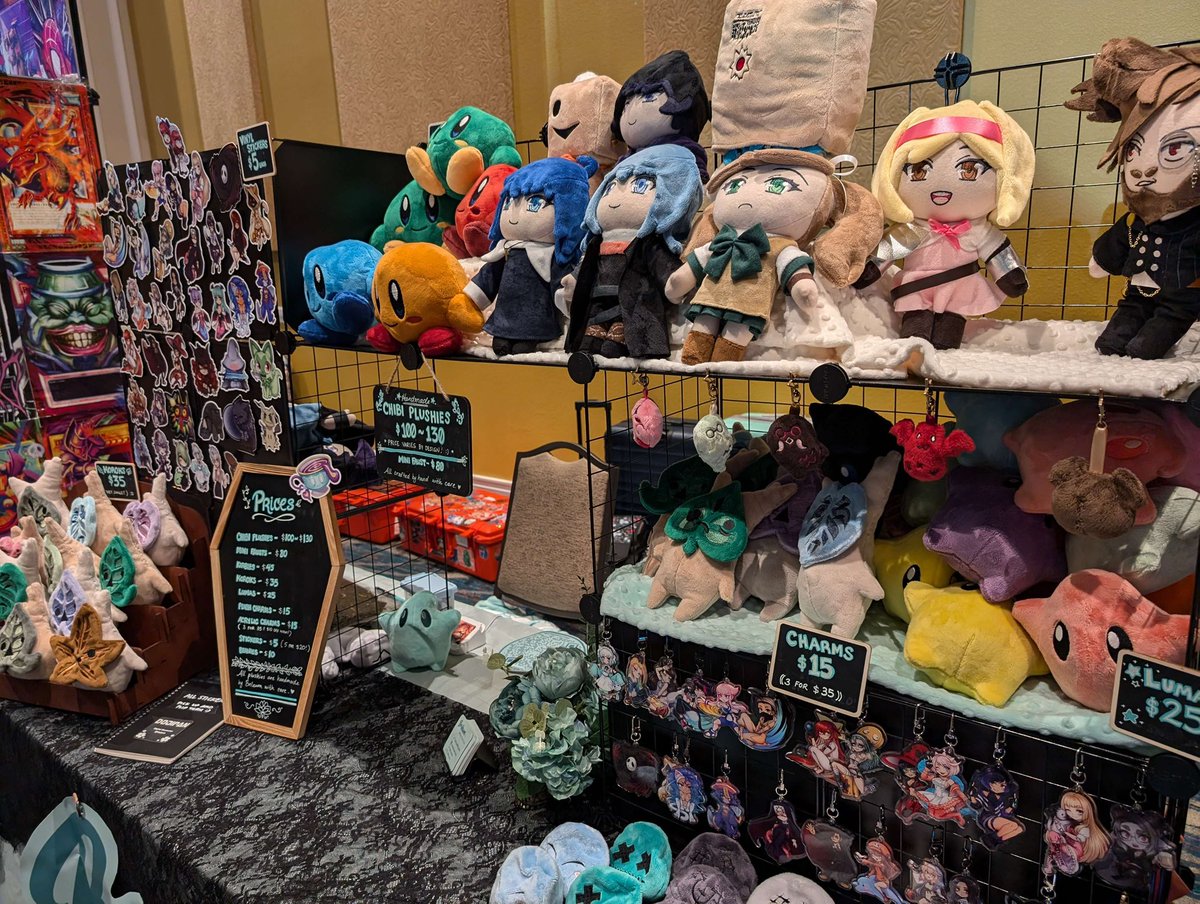 brilewms's tweet photo. Forgot to take a photo lol but here’s all set up for CEO with @Dojipan 

At booth B2 ~ I’ll be behind the booth hand sewing up a couple more chibis and small items :3 https://t.co/7kZFkun0Ck