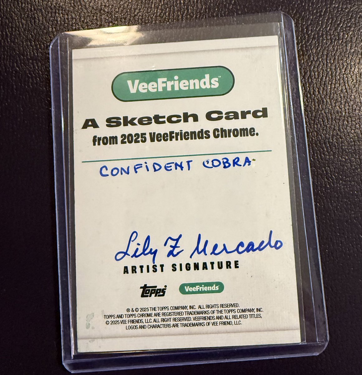 A little late in posting this.. a nice pick up from a <a href="/veefriends/">VeeFriends</a> <a href="/Topps/">Topps</a> Chrome hobby box!  A confident cobra by Lily Mercado! 🐍 💜