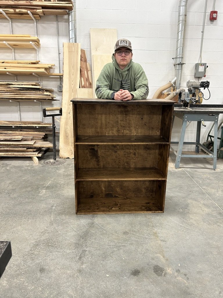 Brayttan built his sister a quality modern-style bookcase out of knotty pine.  Good job, Brayttan!