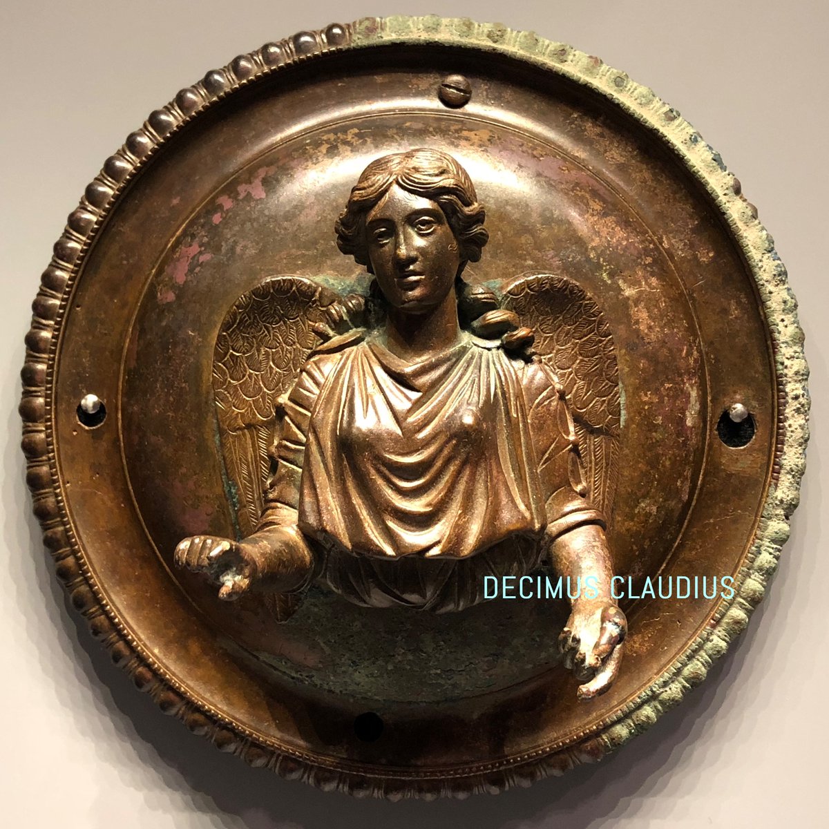decimusclaudius's tweet image. A Roman bronze roundel of Victory from 25 BC-50 AD. On display in the Getty Museum technically located in Pacific Palisades, Los Angeles, California, USA.