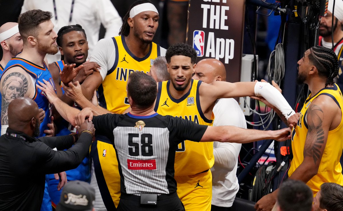 Indiana Pacers guard Tyrese Haliburton (0) holds back Oklahoma City Thunder center Isaiah Hartenstein (55) and Pacers forward Obi Toppin (1) during a scuffle Friday, June 13, 2025, during Game 4 of the NBA Finals at Gainbridge Fieldhouse in Indianapolis. Photo via <a href="/ctannous98/">Christine Tannous</a>