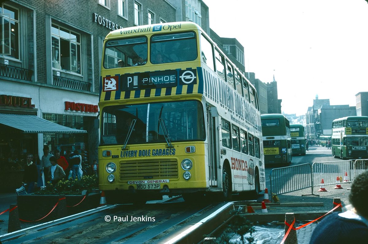 An unusual view of Bristol VRT MOD 573P in Exeter High Street in 1982 during works to lay a new road surface. 573 carried this overall advert for Livery Dole Gararge 1979-1983. The front design was changed early in the contract following an accident. 
Picture credit: Paul Jenkins