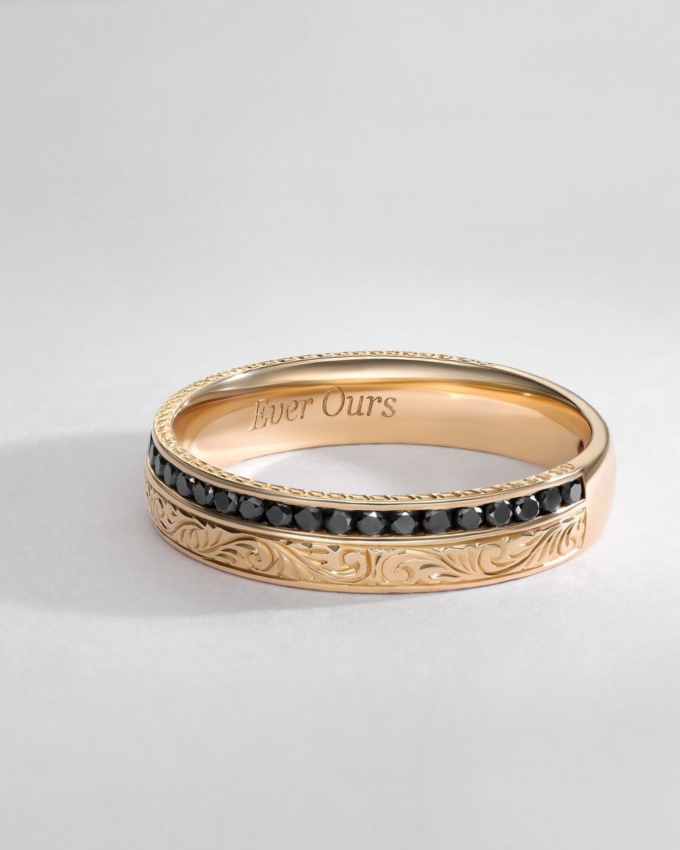 The solitaire diamond engagement ring features textured engravings on the band, and the wedding band complements the cushion cut. 
The channel set band with black diamonds couples with the bride's pairing, and a trio of engravings ties them all together  💍💫
#ringstack