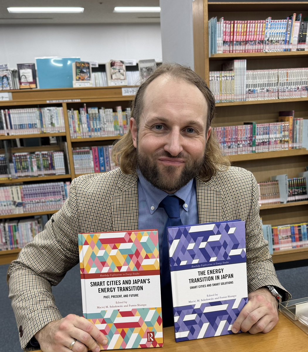 A photo of a happy author donating his books to a public library 😉📚