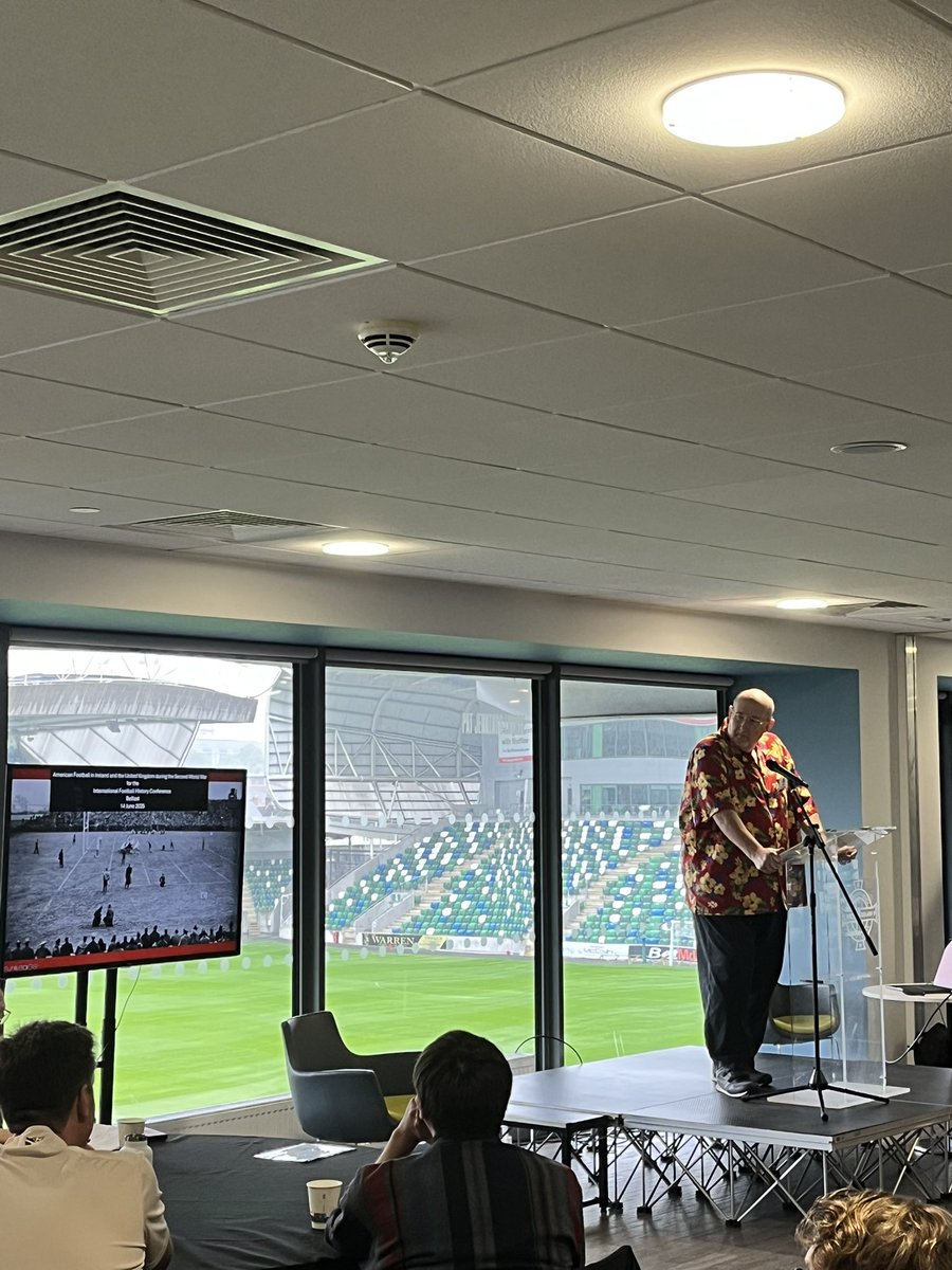 To round out our first session of #footycon25, we have Russ Crawford, equipped with a colourful Hawaiian shirt to combat this miserable Belfast weather, talking about a history of American football (<a href="/NFL/">NFL</a>) in Northern Ireland