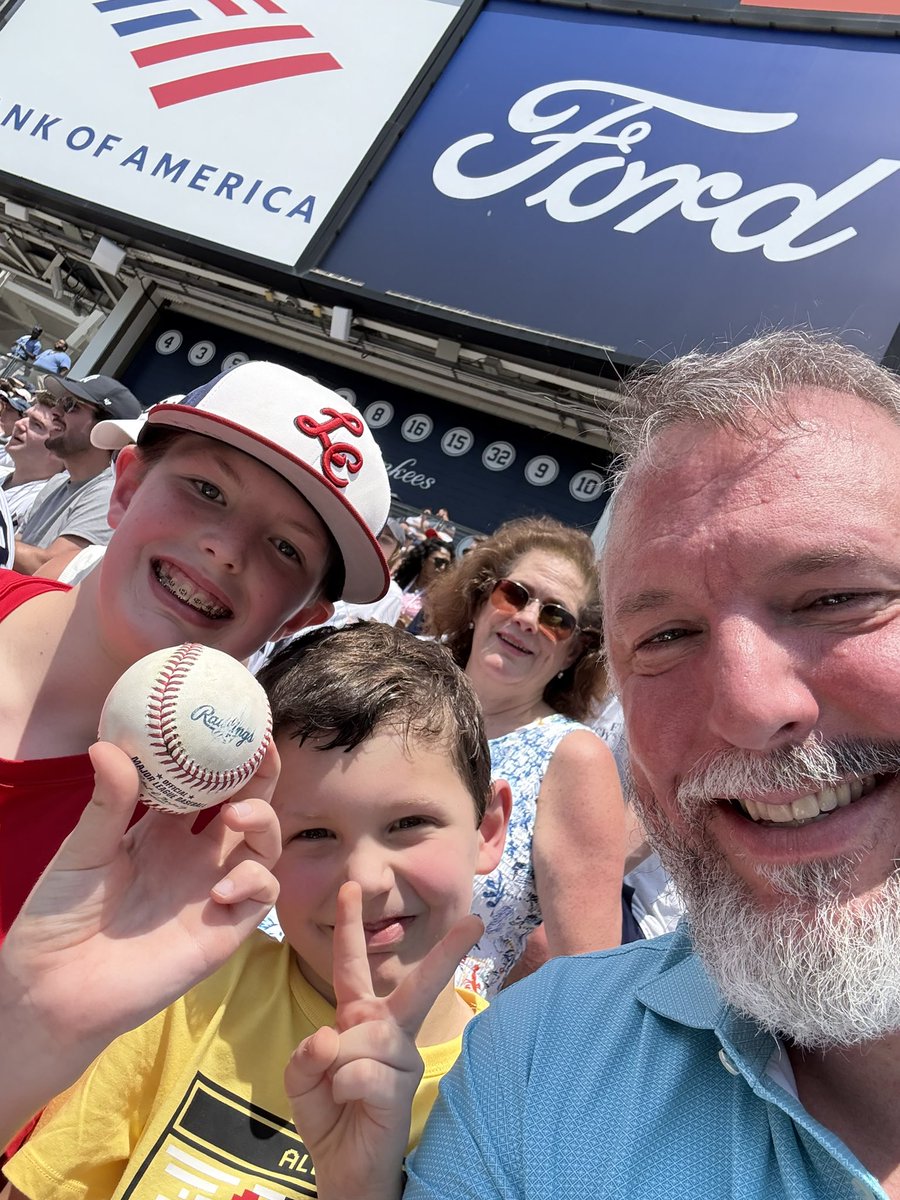 Two boys, two balls. 
I love how baseball players and fans make it about the kids.