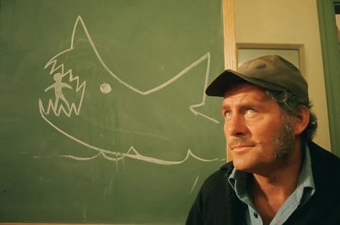 The absolute craziest thing Quint does in Jaws is take the time to make a little drawing of the Kittner boy getting eaten on the chalkboard in the town meeting