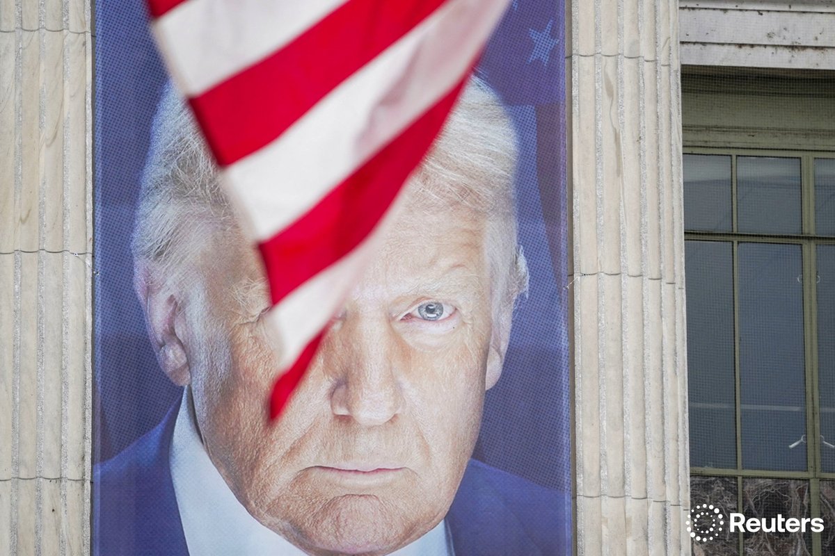 corinne_perkins (@corinne_perkins) on Twitter photo A U.S. flag flutters in front of a banner depicting U.S. President Donald Trump on the day of a military parade to commemorate the U.S. Army's 250th Birthday in Washington, D.C. Photo by <a href="/SmileItsNathan/">Nathan Howard</a> A U.S. flag flutters in front of a banner depicting U.S. President Donald Trump on the day of a military parade to commemorate the U.S. Army's 250th Birthday in Washington, D.C. Photo by <a href="/SmileItsNathan/">Nathan Howard</a>