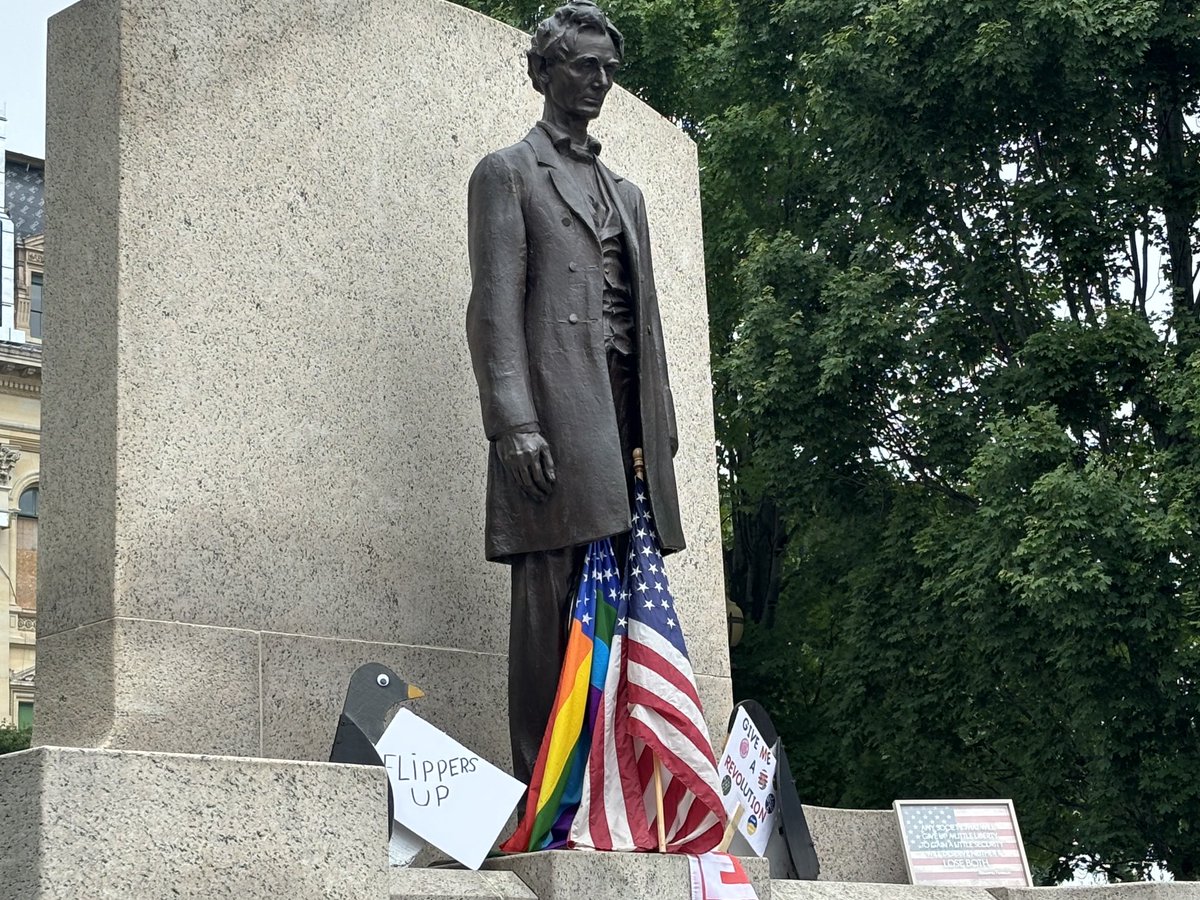 Abraham Lincoln, with a friend, at the Capitol in Springfield, Ill. There is a No Kings protest going on here from noon to 2 PM.