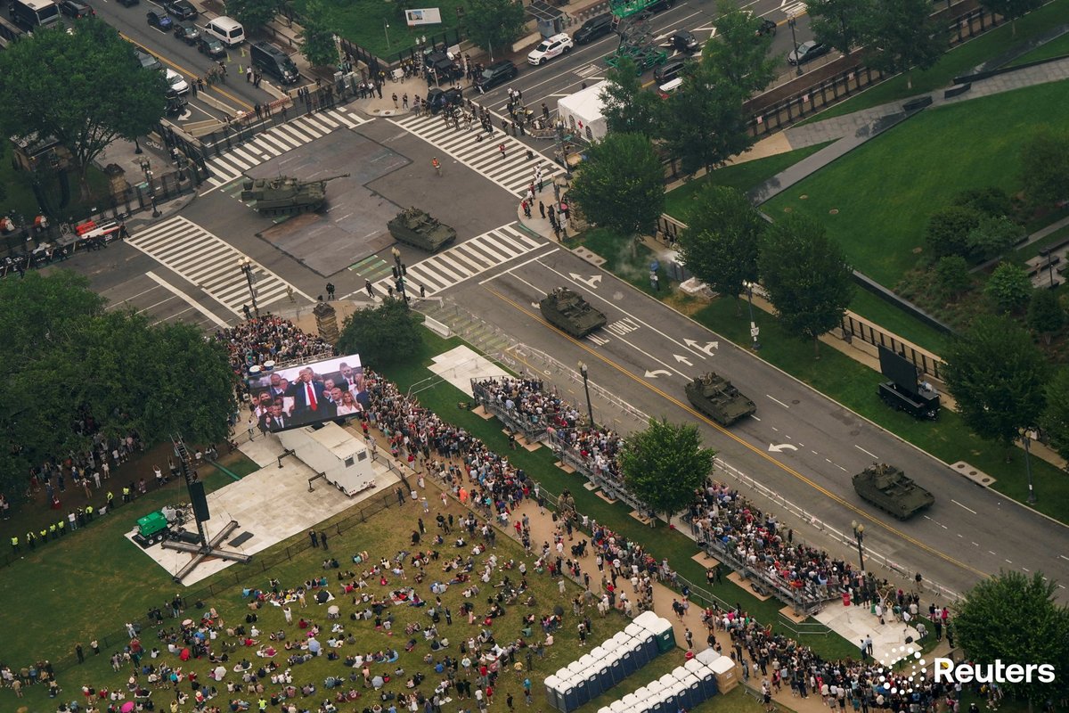 corinne_perkins's tweet image. Armoured vehicles move on a road as people watch during a military parade to commemorate the U.S. Army's 250th Birthday in Washington, D.C. Photo by @lizfrantz