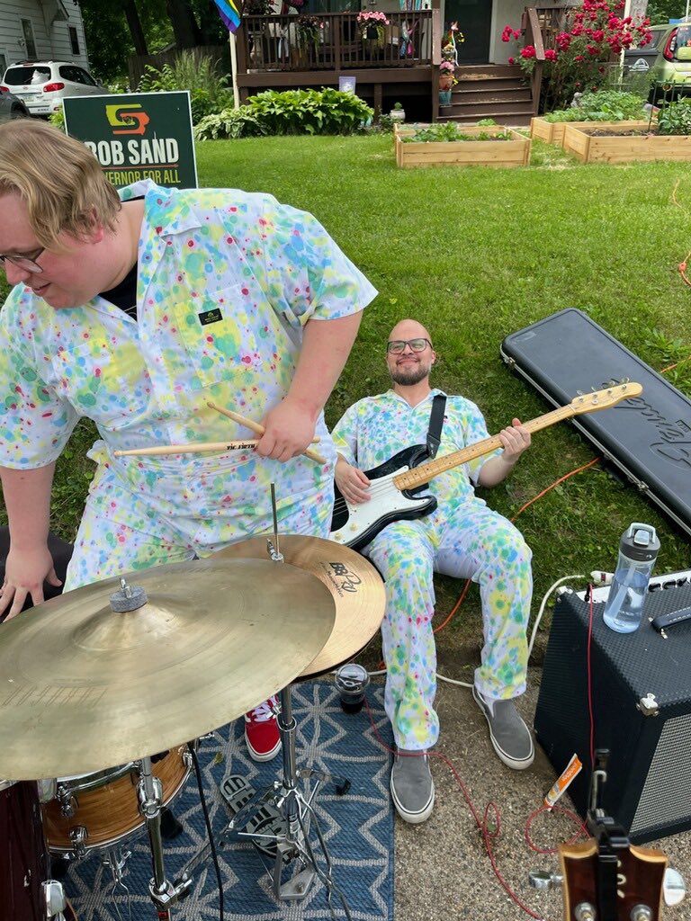 First time playing a show on a sidewalk, first time doing an “encore” where we just laid on the grass to hide from the crowd, first time laying in the grass while holding a bass. The Art Stroll was a success.