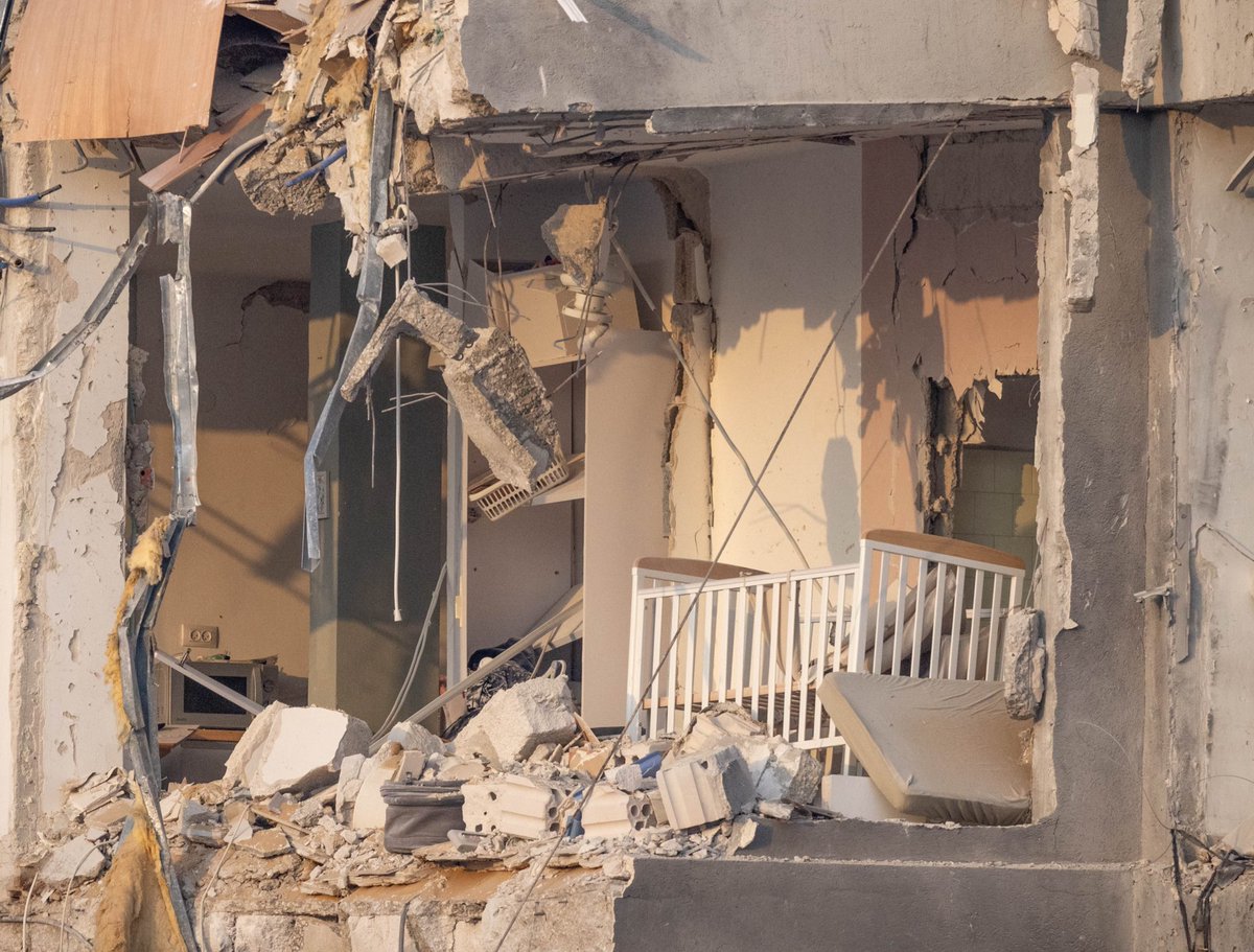 An Iranian ballistic missile against babies sleeping in their cots