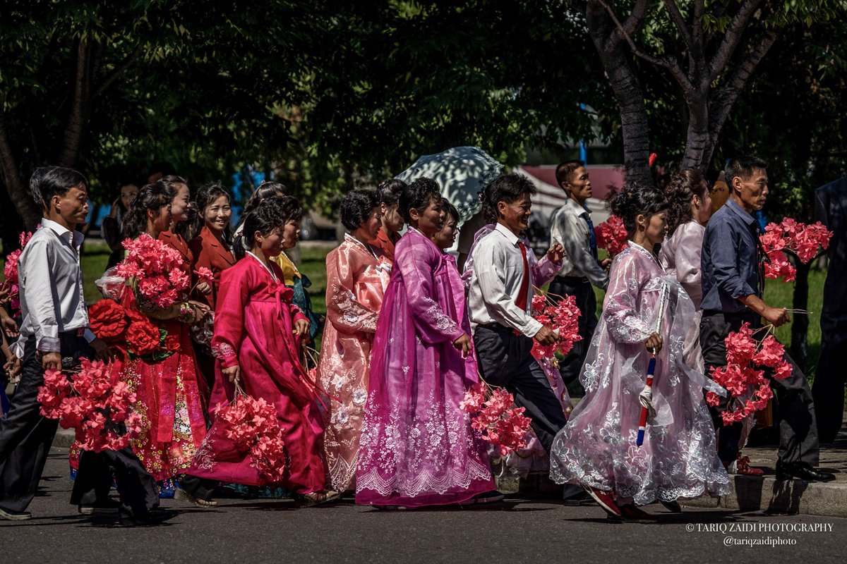 Tariq Zaidi (@tariqzaidiphoto) on Twitter photo Flower bearers head to a parade. #Pyongyang. Image by <a href="/tariqzaidiphoto/">Tariq Zaidi</a> 2018. #NorthKorea #DPRK #Society #Culture #DailyLife #People #DocumentaryPhotography #Photography #NewPhotoBook #Reportage #Monograph Flower bearers head to a parade. #Pyongyang. Image by <a href="/tariqzaidiphoto/">Tariq Zaidi</a> 2018. #NorthKorea #DPRK #Society #Culture #DailyLife #People #DocumentaryPhotography #Photography #NewPhotoBook #Reportage #Monograph