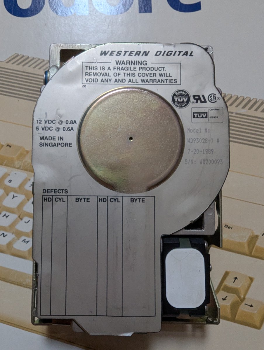nyimski's tweet image. The Commodore A590 hard drive model number WD-93028-X A weighed 797g, had a 20MB capacity and used the ST-506/412 interface, a precursor to IDE. This interface required a separate controller card for data and control signals and used MFM (Modified Frequency Modulation) encoding.