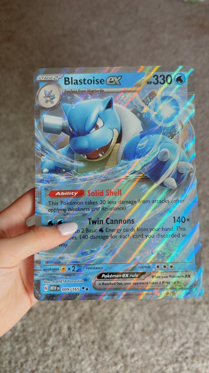 someone said I have small hands?? this is me holding a standard pokemon card btw
