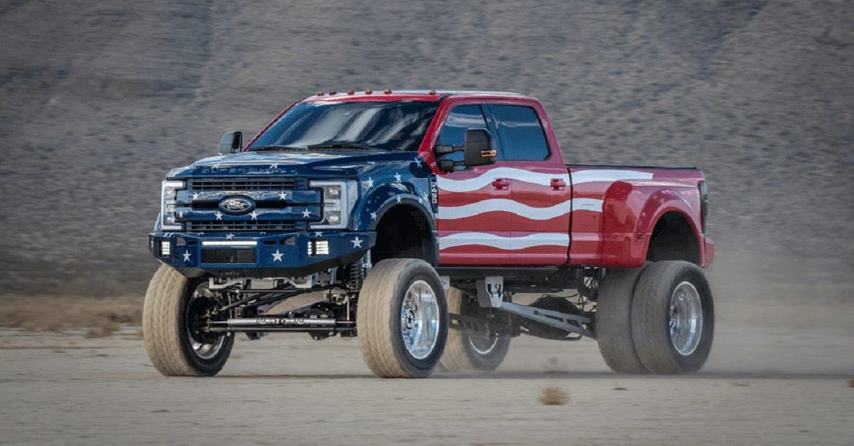 SevenGuy_'s tweet photo. @Churino_ Raised suspension pickup truck with star raiders themed flags and anti autobot and deception political bumper stickers https://t.co/K7l4YAQVwl