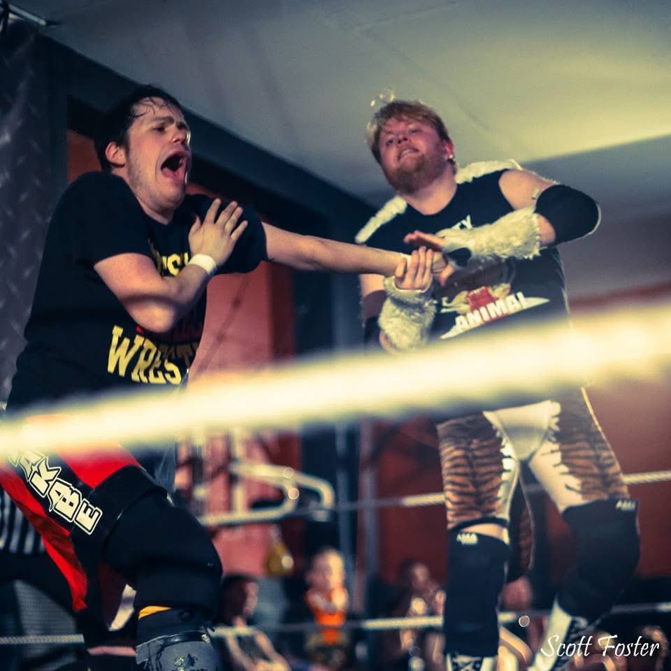 It’s hard to believe but it’s been 1 year since our friend “Big Cat” Scott Henson passed away. Someone that I met via the DVDVR when we were 17 years old + truly owe a lot of cool things I’ve done in wrestling/my life in general to. Make your Dad watch a Scott match today🖤🧡🖤🧡