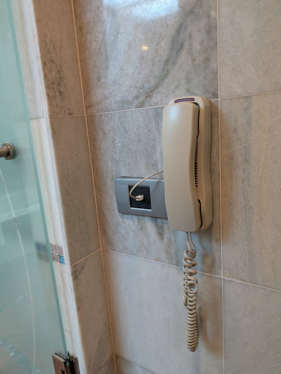 Why is there a phone on the shitter