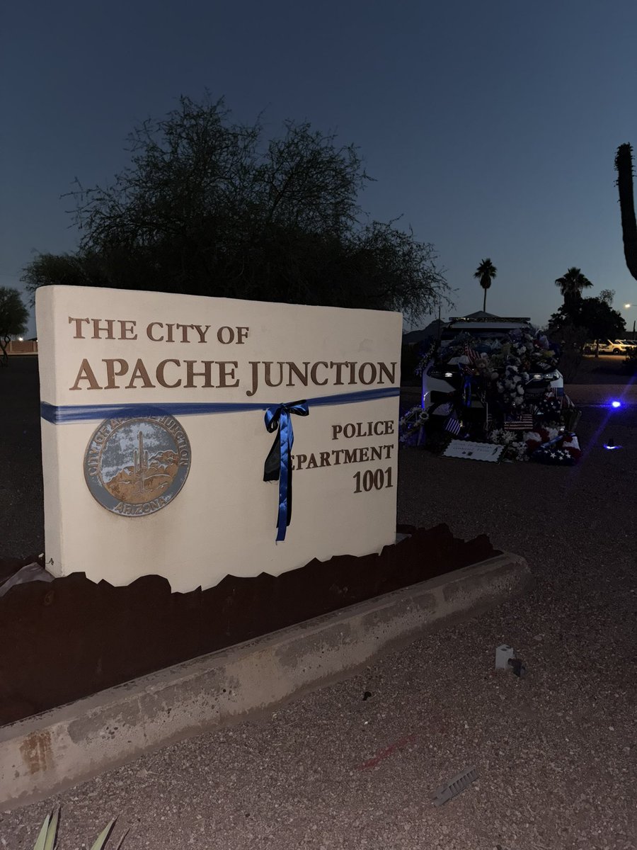 mrtroylynch's tweet image. Today is Apache Junction Police officer Gabriel Facio’s procession and funeral. The procession starts at 7:45am here at AJ Police Department where you can see there are multiple tributes to officer Facio who was killed in the line of duty. @12News