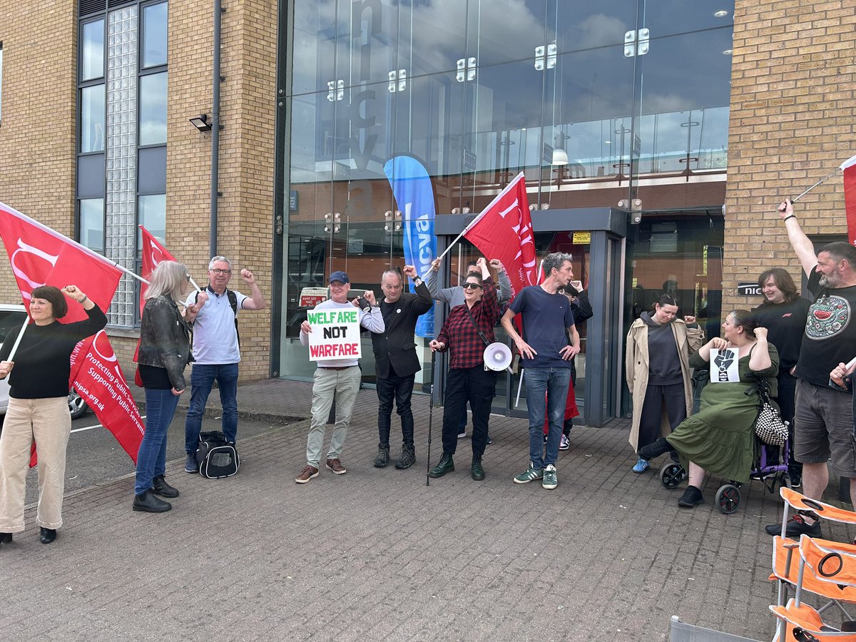 Protest underway at DWP Consultasham event in Belfast.

#WelfareNotWarfare