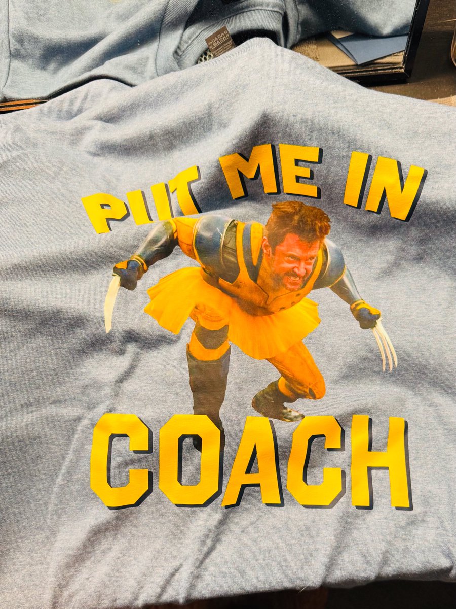RealHughJackman's tweet image. I meet folks as I come in and out of the theatre. And sometimes I am given a gift. Beth Chadbourne gifted me this because she knows my favorite T is the one with Jim Carey on it saying “put me in coach”. I will never give that one up. But … I am going to start breaking this one…