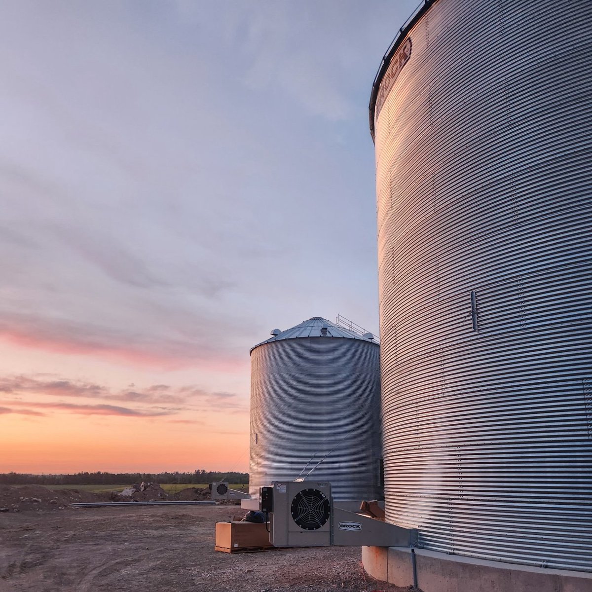 Grain bins by twilight! Our AGHS and ACi Industrial family are installing a full system from start to finish, and these shots of the <a href="/brockgrain/">Brock Grain Systems</a> grain bins were too good not to share! Talk to us about how we can help you grow.