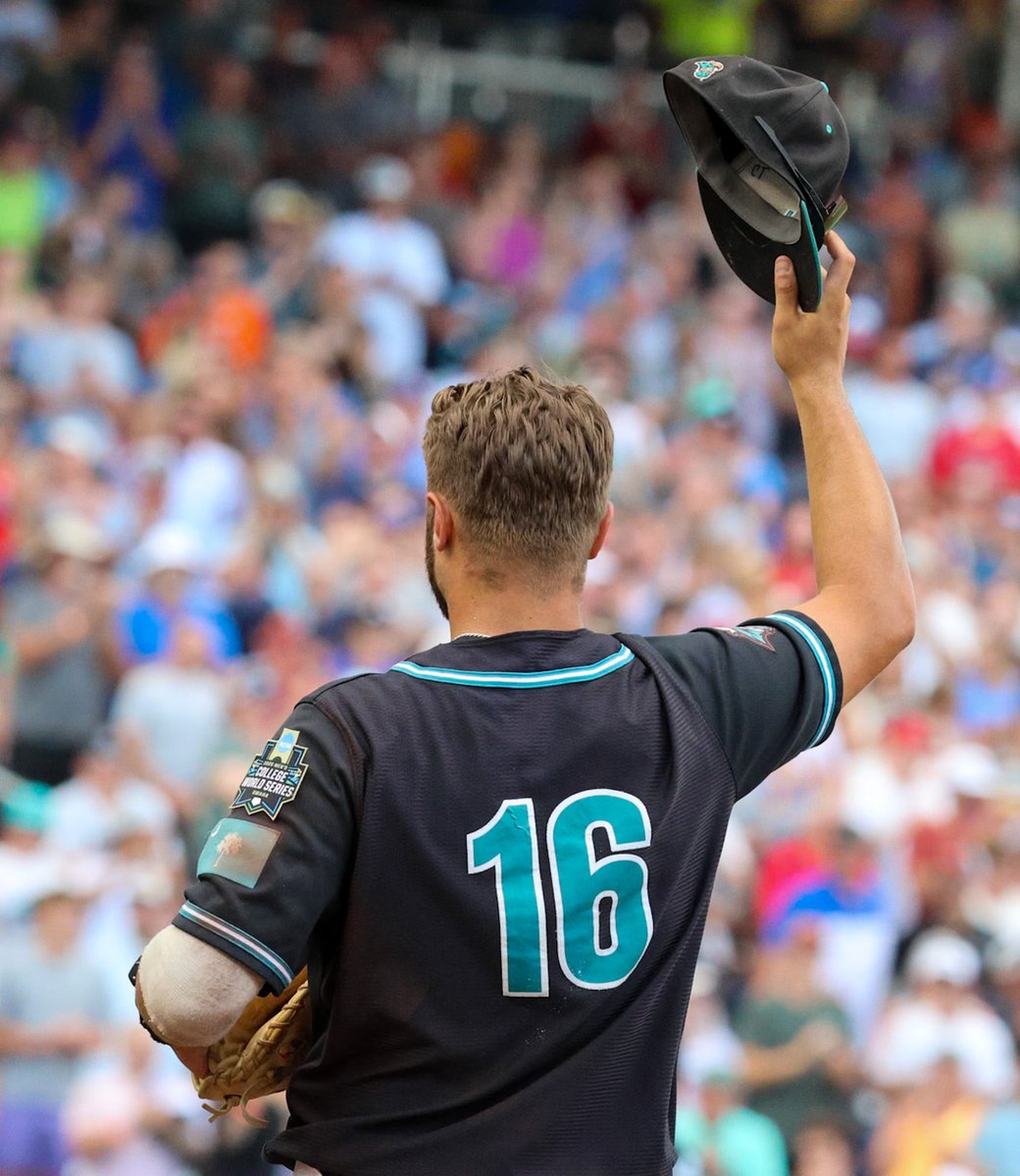 Colby salutes the military service personnel being introduced in between innings