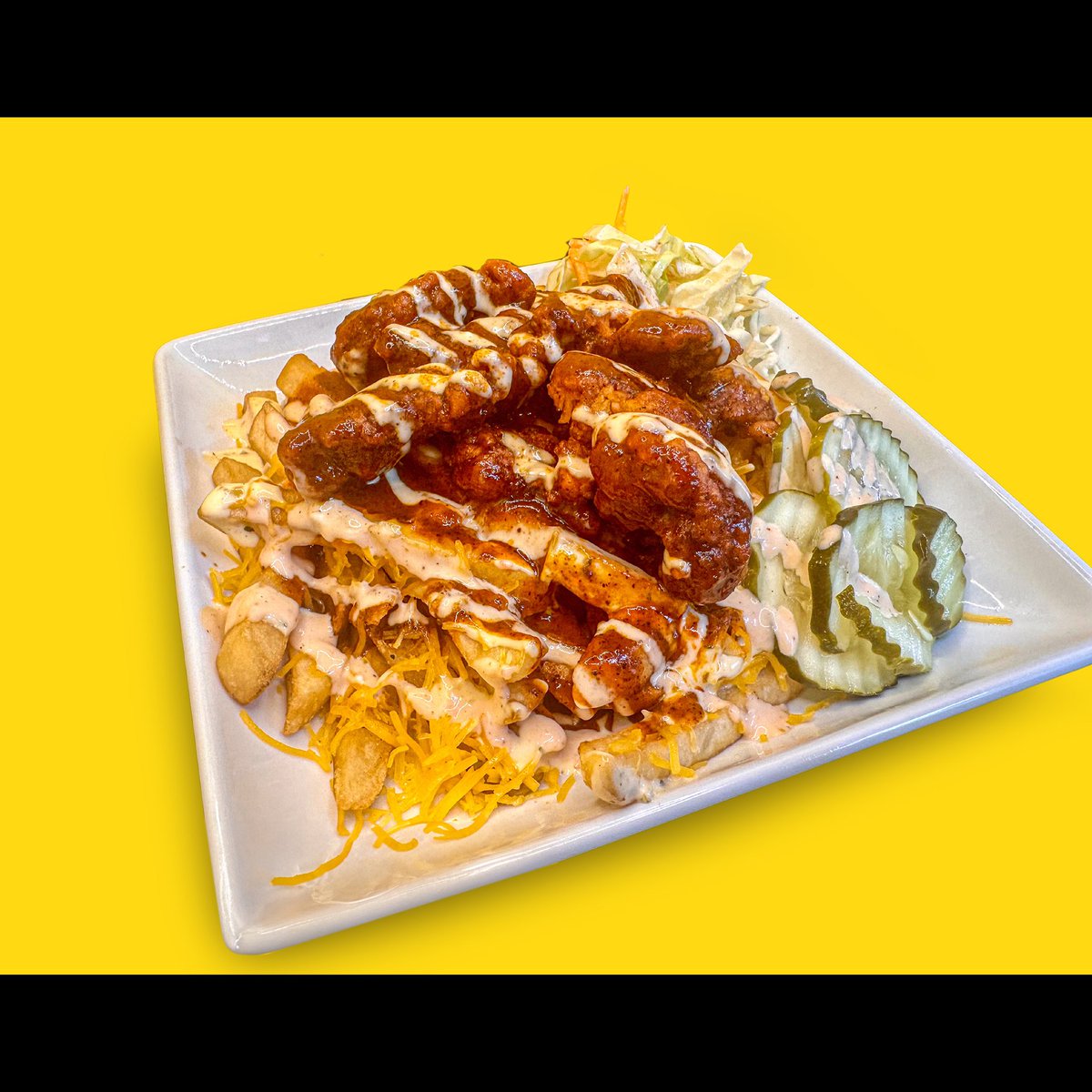 Craving a flavor explosion? Try our Nashville Hot Chicken! Packed with house-made slaw, all-day sauce, cheddar cheese, hot Nashville-inspired chicken, pickles and a dash of chili powder. It's a fan favorite for a reason! 🍗🔥🍟 #NashvilleHotChicken #FryDayFaves #SpiceLovers