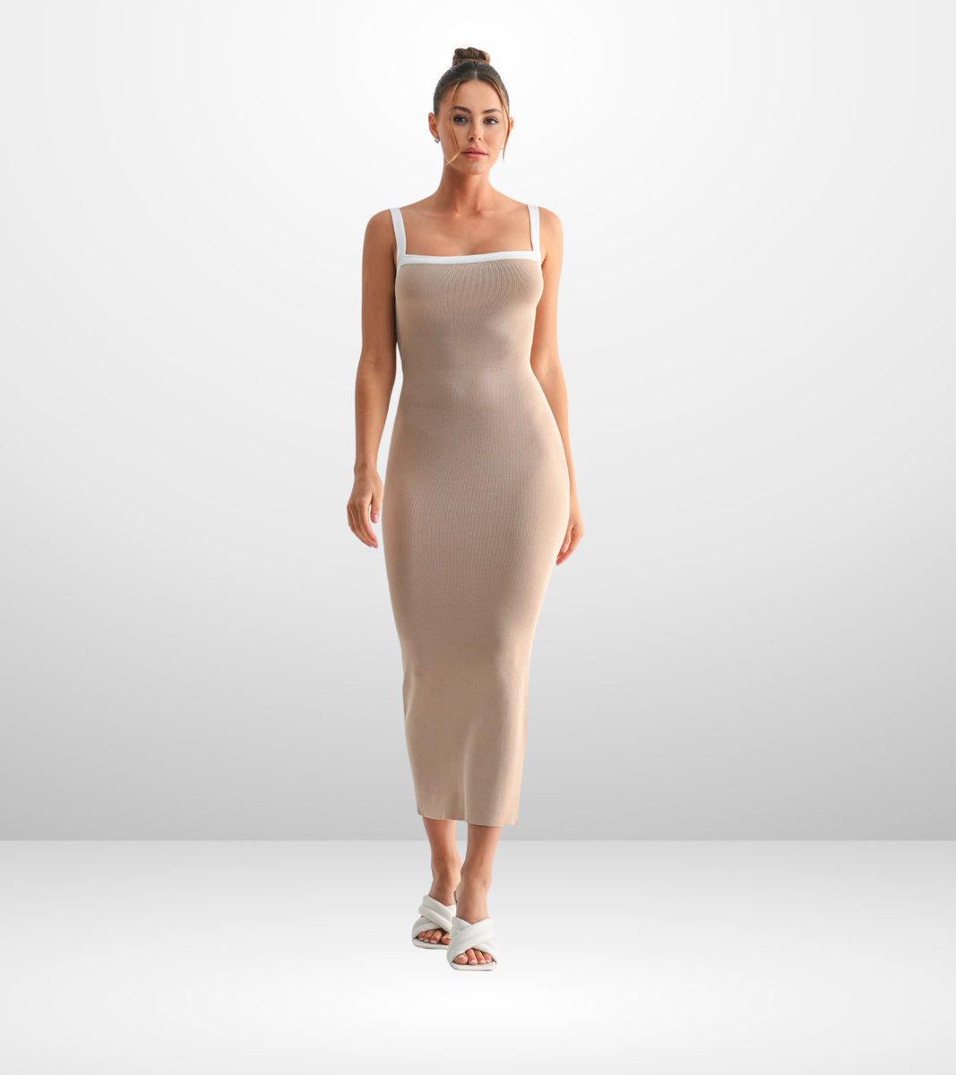 Designed with a clean, minimal silhouette made to sculpt and define. Shop Mila Sculpted Frame Midi Dress now on stellale.com