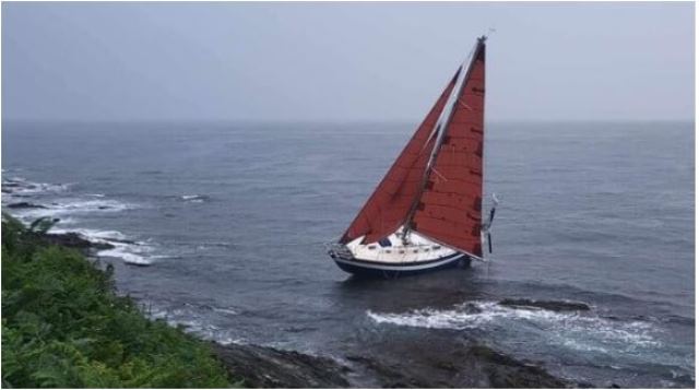 UK Coastguard and RNLI launched extensive search 3 days ago for survivors after yacht found  high and dry on   Cornish coast, its sails still set but with no one aboard, aground at Chapel Point.  No further details at this time. Photo – HM Coastguard.