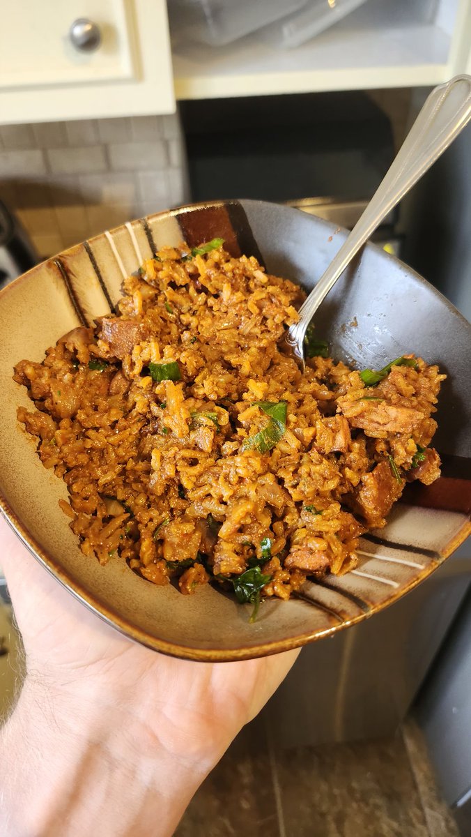 Your otter boyfriend made some jollof rice and chorizo for the first time, really love the combination of spices and all that.
