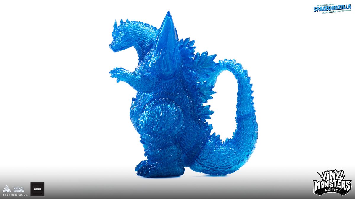 Unleash the cosmic terror with this exquisite sofubi masterwork. Crafted from a clear dark blue vinyl and adorned with multi-layered glitter to emulate a celestial constellation, this limited edition Spacegodzilla captures the fearsome Kaiju’s menacing presence with stunning
