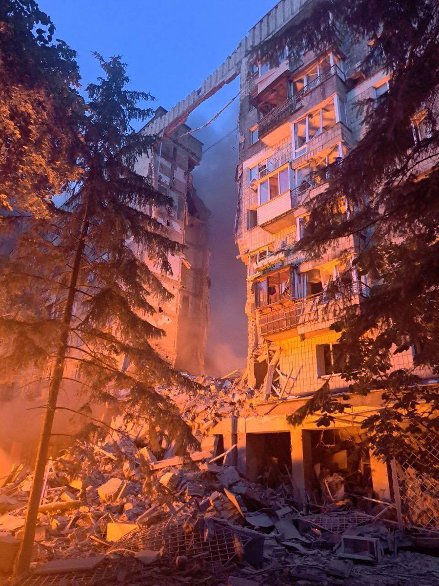 sentdefender's tweet image. A direct strike from a Russian missile has caused a large section of a high-rise residential building to collapsed in the Ukrainian capital of Kyiv, with search-and-rescue operations currently ongoing.