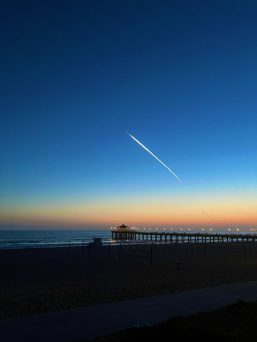 A summer sunset drenched the Manhattan Beach pier tonight as <a href="/SpaceX/">SpaceX</a> put on a show overhead.
