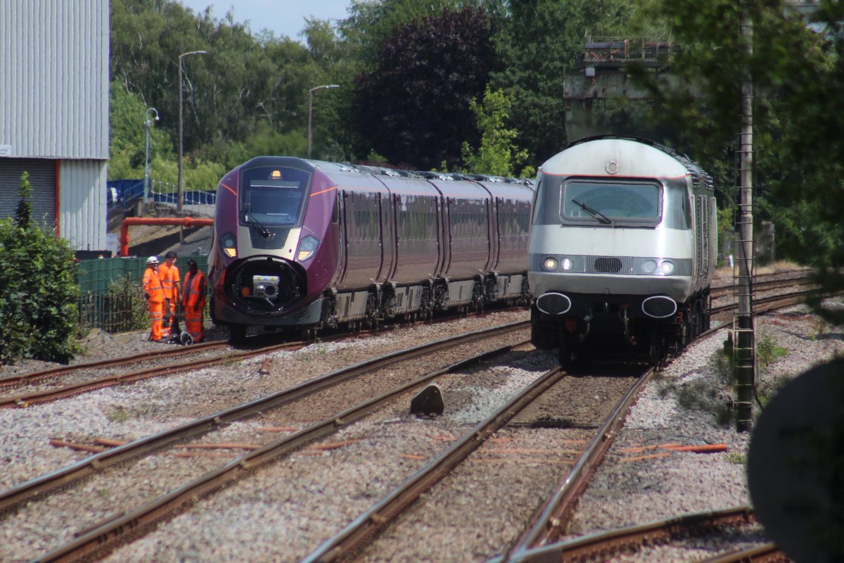 LeicRailAle170's tweet image. 43468 + 43480 0M21 Mid-Norfolk Railway Siding -Burton OT Wetmore Sidings passes 810003, Old Dalby - Merchant Park Sidings  at Melton Mowbray 16.6.25. The 810 was hauled by 66732, out of shot running round. #HighSpeedTuesday