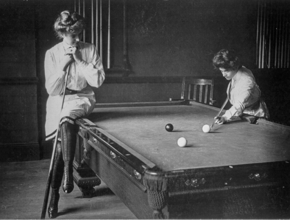 Two unidentified women playing billiards. Photographed in 1903.