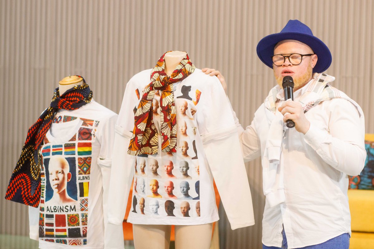 In our climate work, the community said:

"We want sun-protective wear that's also fashionable."

Our ED <a href="/thealanherbert/">Alan Herbert</a> responded with a design:

Detachable scarf (UV protection)
Removable sleeves
Bold art to raise #Albinism awareness

Next: more colors, smoother sleeve joints!