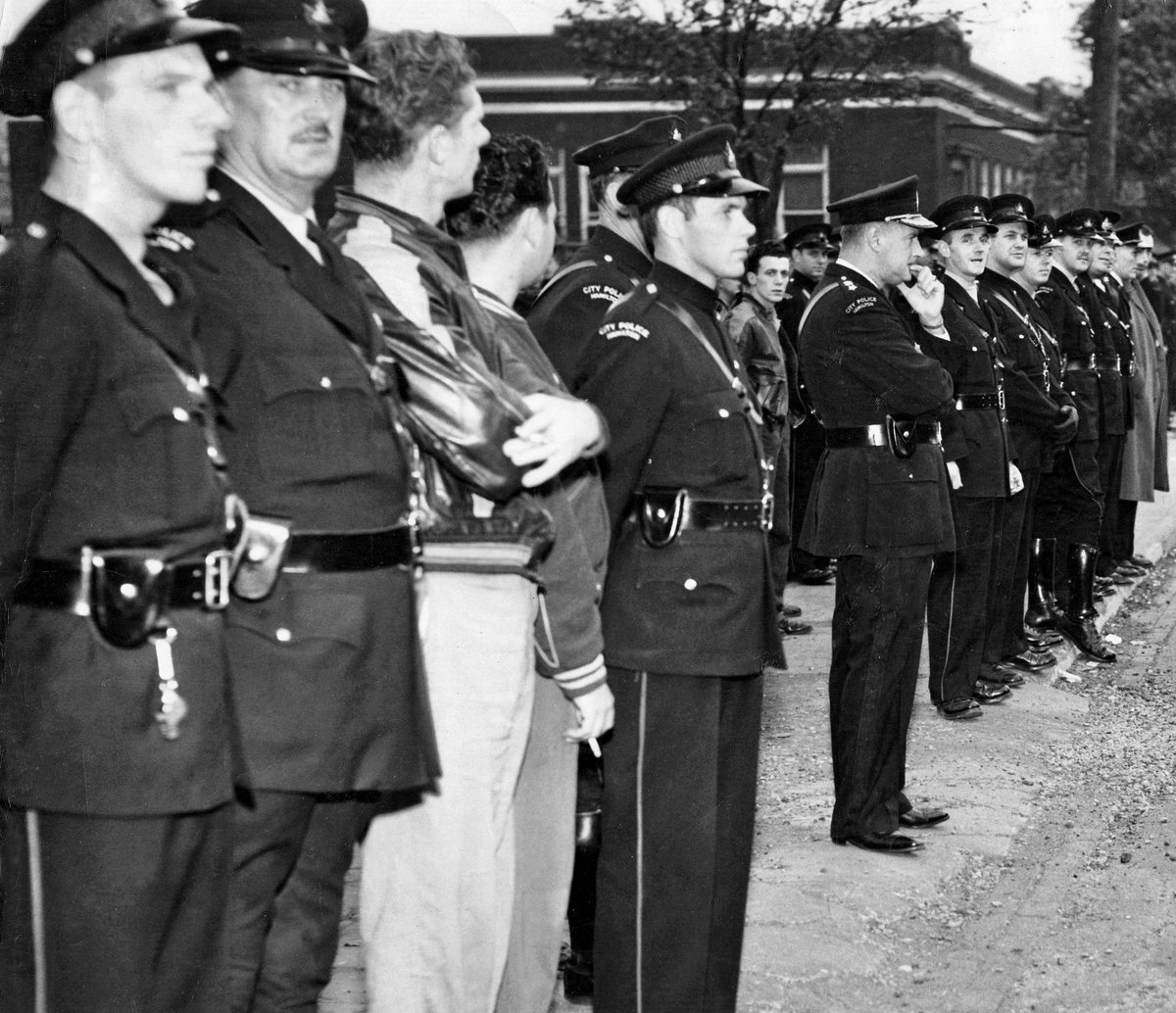 HPS_Museum's tweet photo. 1952 Officers line the street accompanied by Chief Leonard Lawrence for the Cotton Strike. #HPSArchives #PoliceHistory #HamOnt #HamOntHistory #HPSHistory #HPSMuseum https://t.co/kpWhR1mNx4